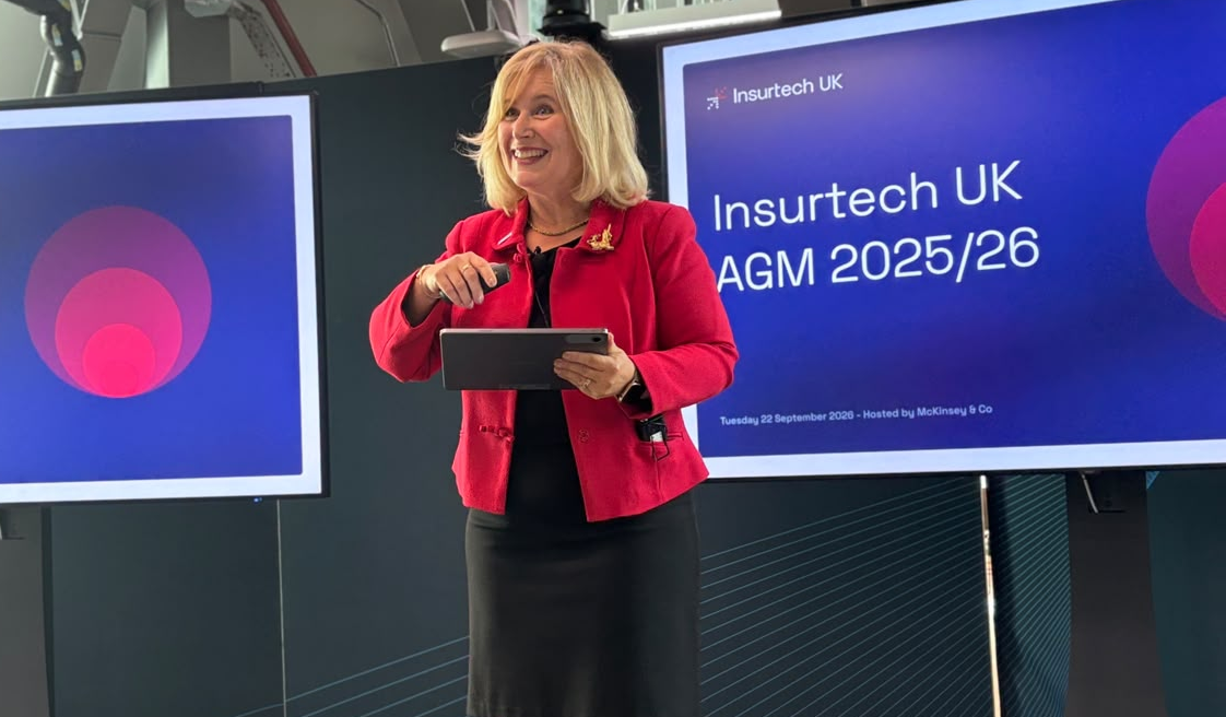 Woman presenting on stage